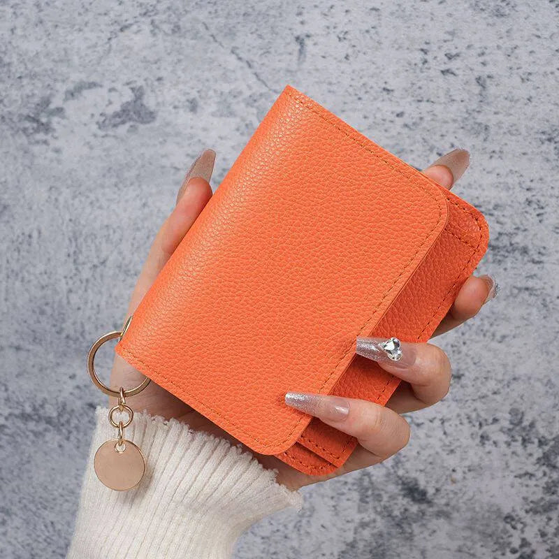 πA retro-style wallet, palm-sized, that can hold multiple cards and features a hidden pocket.