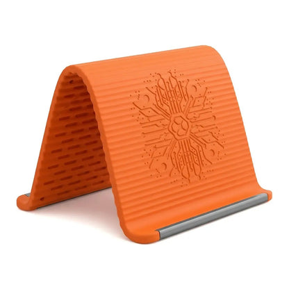 A flexible phone holder made of memory metal and silicone—bendable, rollable, and foldable.